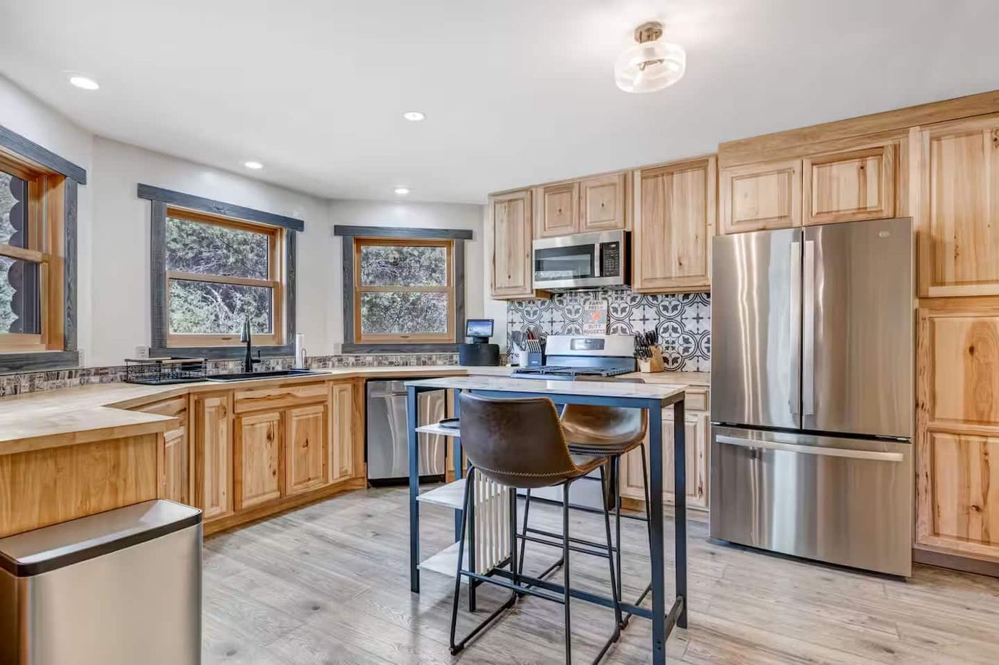 Kitchen with stainless appliances and hickory cabinets