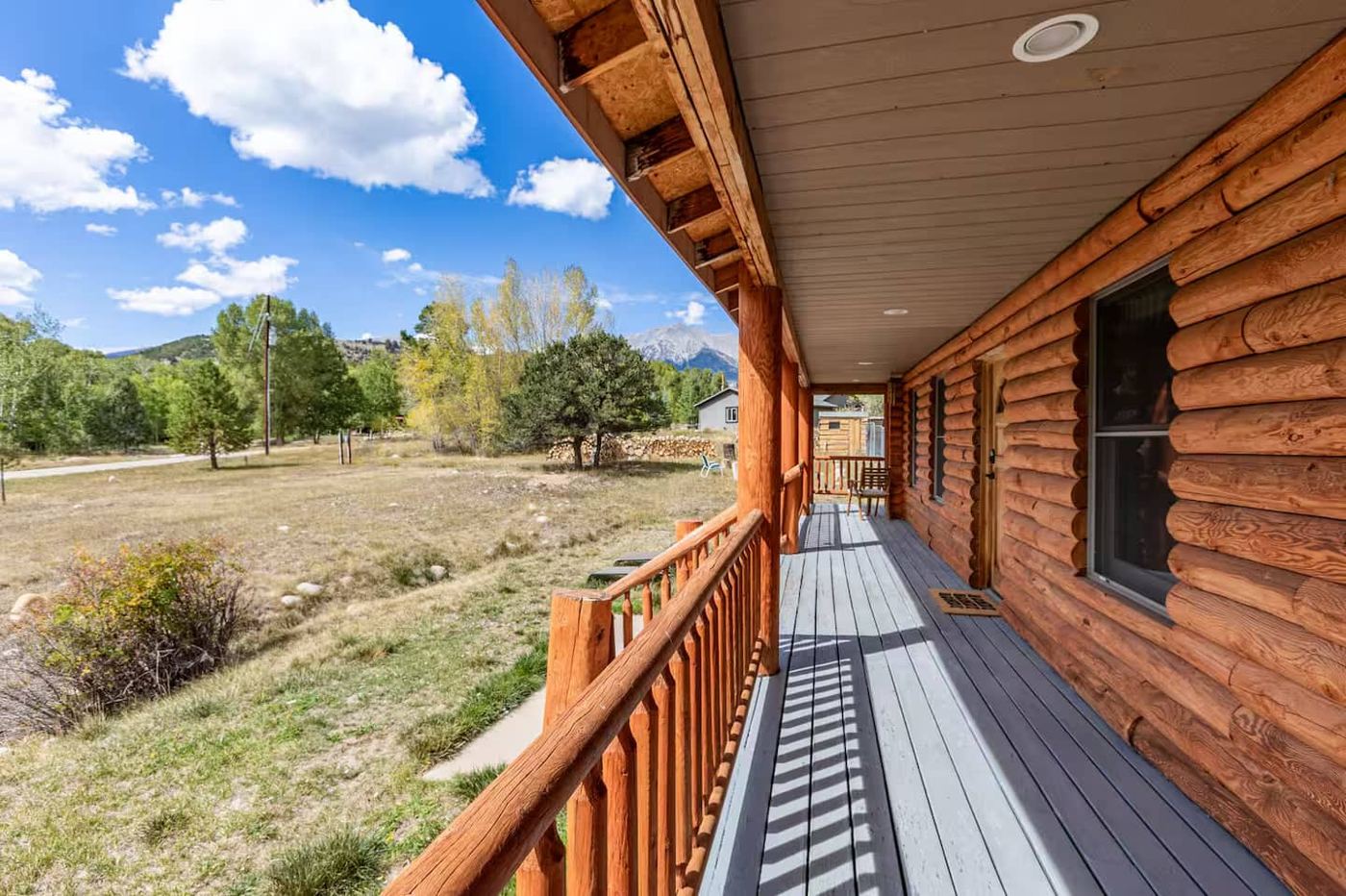 Covered wraparound porch with mountain view