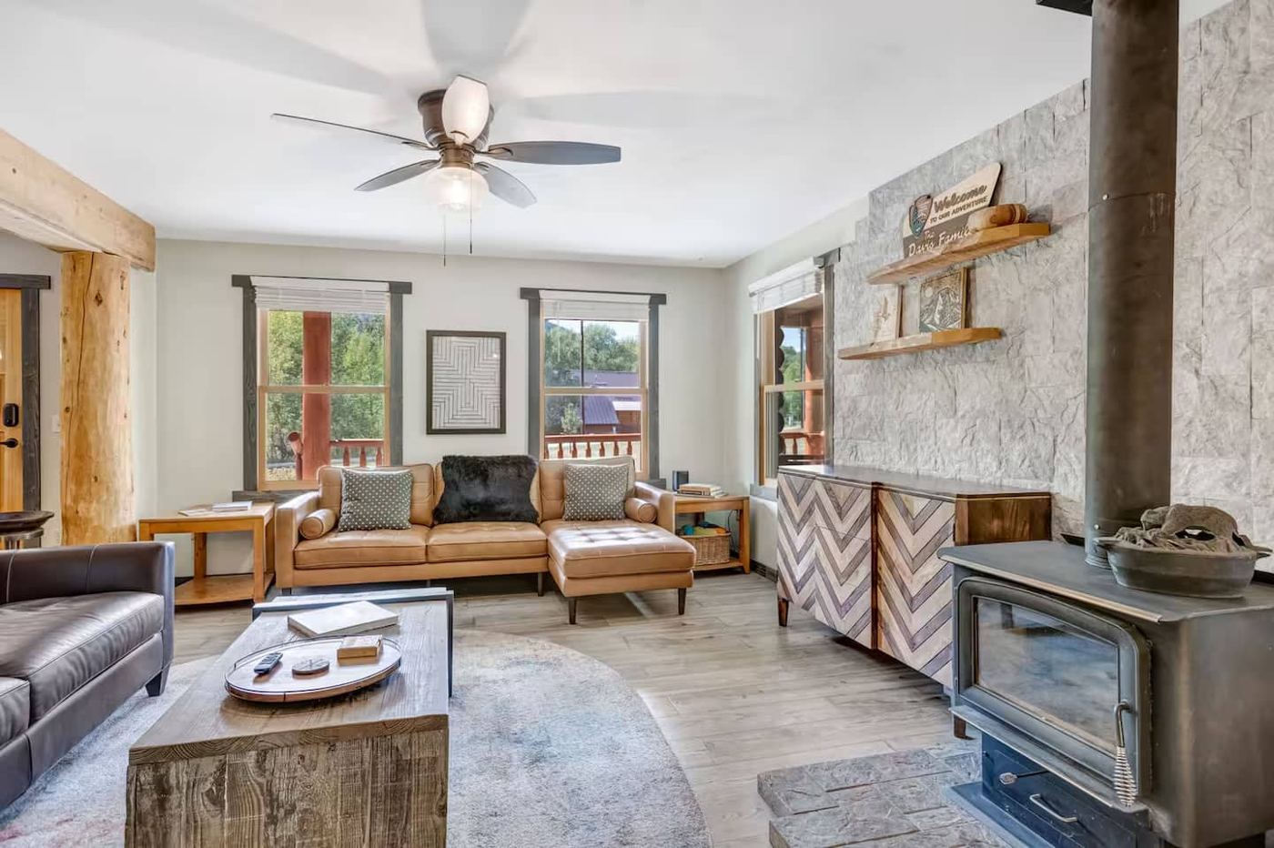 Living room with wood stove and leather sofas
